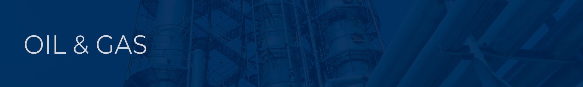 Industrial equipment and pipelines at the gas processing plant on a bright sunny summer day with blue overlay
