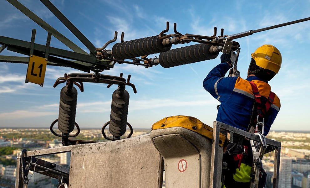 Electrical engineer repairing the electrical network on an elevation boom